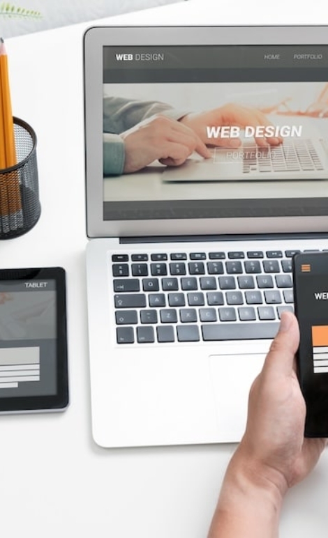 Web developer designs websites for different types of devices. Responsive web design concept